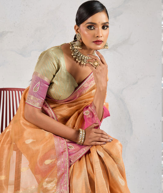 Charming Light Orange Soft Tissue Linen Saree With Pretty Blouse Piece