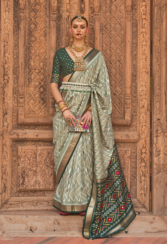 Light Green Patola Silk Zari Weaving Work Saree With Contrast Blouse
