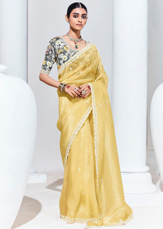Light Yellow Organza Silk Saree With Delicate Embroidery Work