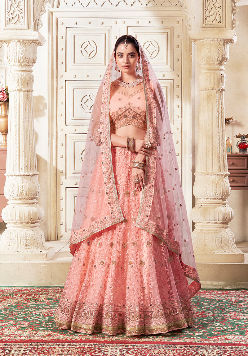 Peach Net Thread Embroidery And Stone Work Lehenga Choli