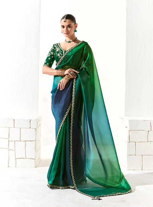 Green Tissue Silk Saree Featuring Intricate Sequins Work