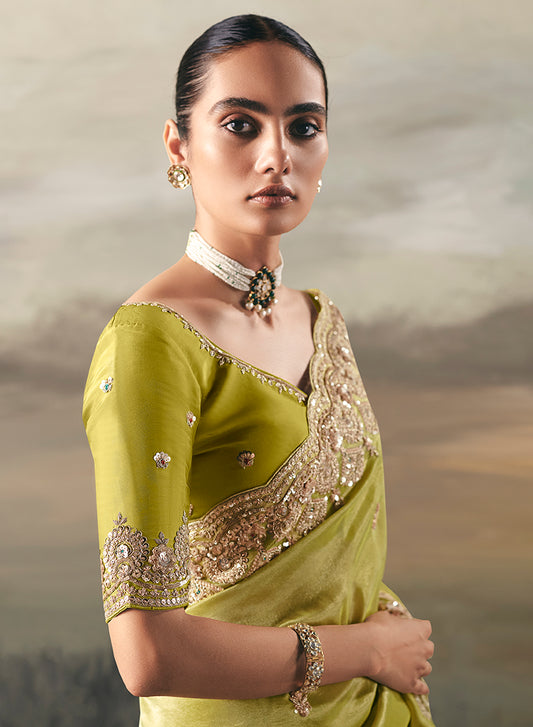 Parrot Green Elegant Party And Wedding Wear Tissue Saree With Designer Contrast Hand Work Blouse